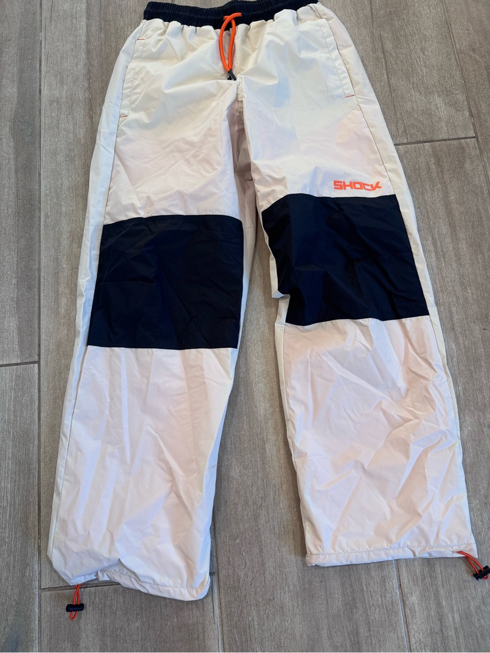 Shock Doctor Kids White and Black rain, windbreaker, lined pants 100% polyester